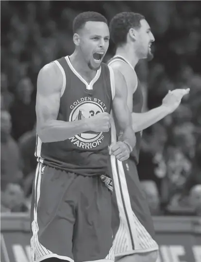  ?? Mark J. Terrill / Associated Press ?? Stephen Curry, who had 40 points, celebrates with Klay Thompson in the second half of the Warriors’ comeback.