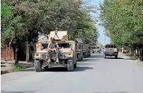  ?? AP ?? Afghan security forces arrive during a fight against Taliban fighters in Kunduz province north of Kabul.