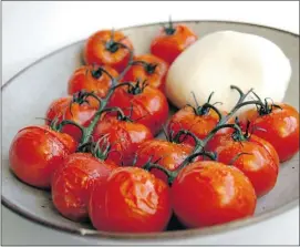  ?? Gwendolyn Richards/calgary Herald ?? Roasted tomatoes with white gold fior di latte make an easy party appetizer to pop in your mouth while enjoying a glass of wine.