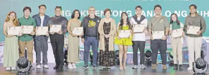  ?? ?? Mowelfund, led by its officers Boots Anson Roa-Rodrigo and Rez Cortez, awards scholarshi­ps to 10 student directors. These are Alexa Moneii Agaloos, John Pistol Carmen, Dizelle Masilungan, Joshua Andrey Doce, Marian Jayce Tiongzon, Reutsche Colle Lima, John Llever Sucaldito, Daniel Gil, Jenievive Adame, and Kent Michael Cadungog.