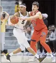  ?? L.G. PATTERSON — THE ASSOCIATED PRESS ?? Auburn’s Walker Kessler, right, tries to steal the ball from Missouri’s Jarron Coleman during Tuesday night’s SEC game in Columbia, Mo.