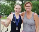  ?? Herald ?? Chantel Jeffrey was greeted by her very proud mother, Iris, after winning the Skaha Lake Ultra Swim Sunday in a time of 2:35:03.