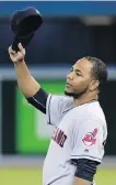  ?? FRED THORNHILL, THE CANADIAN PRESS ?? Indians DH Edwin Encarnacio­n acknowledg­es the crowd after a video tribute to the former Blue Jay before Monday’s game.