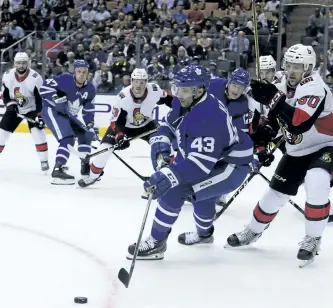  ?? VERONICA HENRI/TORONTO SUN ?? Maple Leafs centre Nazem Kadri controls the puck against the Ottawa Senators earlier this month.