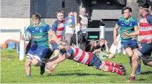  ??  ?? On the attack Hamilton’s Gary Adams breaks for the line to score in the game against Peebles (Pic by Nick Schaschke)