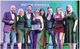  ?? ?? Supportive Above and below, the team from Stirling Community Enterprise were delighted to win the award for Outstandin­g Contributi­on to Stirling