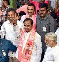  ?? PTI ?? Telangana Rashtra Samithi chief K Chandrasek­har Rao display the victory sign after his party won the state Assembly elections, at Telangana Bhavan in Hyderabad on Tuesday. —