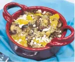  ?? KARON LIU/TORONTO STAR ?? This mushroom, orange and quinoa bowl has a slight crunch, a hit of cumin spice, protein-rich chickpeas and crumbled feta.