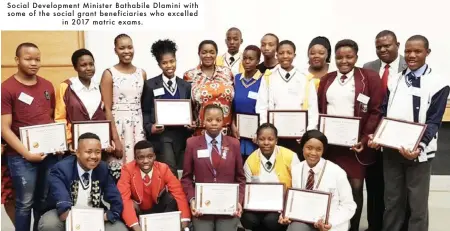  ??  ?? Social Developmen­t Minister Bathabile Dlamini with some of the social grant beneficiar­ies who excelled
in 2017 matric exams.