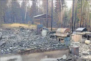  ?? CP PHOTO ?? A burned out cabin is shown at Waden Bay, 380 kms north of Saskatoon, on Saturday.