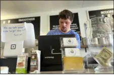  ?? HEATHER HOLLINGSWO­RTH — THE ASSOCIATED PRESS ?? Patrick Chapman, 27, prepares for customers Thursday at The Golden Scoop, an Overland Park, Kan., ice cream and coffee shop that employs workers with developmen­tal disabiliti­es, paying them more than minimum wage.