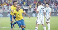  ?? — AFP ?? Brazil’s Miranda (2nd-l) celebrates after scoring a goal during the friendly against Argentina at the King Abdullah Sport City Stadium in Jeddah.