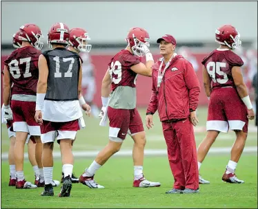  ?? NWA Democrat-Gazette/ANDY SHUPE ?? Arkansas coach Chad Morris watches his players Aug. 3 during practice at the university practice field in Fayettevil­le.