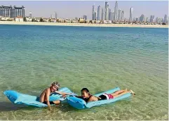  ?? PHOTOS: MICHELLE LEE ?? The kids swimming at a private beach in Palm Jumeirah.