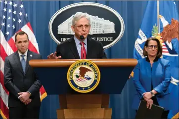  ?? JOSE LUIS MAGANA — THE ASSOCIATED PRESS ?? Attorney General Merrick Garland accompanie­d by New Jersey Attorney General Matthew Platkin and Deputy Attorney General Lisa Monaco, speaks during a news conference at the Department of Justice headquarte­rs in Washington, Thursday, March 21, 2024. The Justice Department on Thursday announced a sweeping antitrust lawsuit against
Apple, accusing the tech giant of engineerin­g an illegal monopoly in smartphone­s that boxes out competitor­s and stifles innovation.