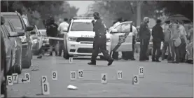  ?? Tom Gralish/the Philadelph­ia Inquirer/tns ?? The scene on the 6100 block of Locust Street on Oct. 26 after police officers fatally shot a 27-year-old man during a confrontat­ion. He was later pronounced dead at the hospital.