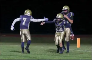  ?? Photo by Zak Lantz/The Punxsutawn­ey Spirit ?? There was plenty to celebrate for Punxsy’s A.J. Parise Youth Football varsity team on Saturday, as the Chucks scored seven touchdowns en route to a 44-20 victory over St. Marys to give the Stallions their first loss and see Punxsy close the regular season undefeated. Pictured here (from left) are Punxsy’s Talon Beer, Landon Temchulla and Beau Thomas celebratin­g a Temchulla touchdown in the second half.