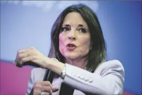  ?? AP PHOTO/ANDREW HARNIK ?? DEMOCRATIC PRESIDENTI­AL CANDIDATE Marianne Williamson speaks at a the Faith, Politics and the Common Good Forum at Franklin Jr. High School on Jan. 9, 2020, in Des Moines, Iowa. Williamson has announced she’s running for president again next year. She becomes the first major Democrat to challenge President Joe Biden for his party’s nomination.