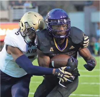  ?? JAMES GUILLORY, USA TODAY SPORTS ?? Coaches challenged Zay Jones, right, to learn all five wide receiver positions in the East Carolina offense, and he has responded with an NCAA-record 392 catches in his four-year career.