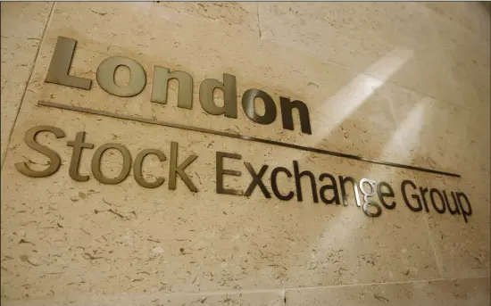  ??  ?? This Sept 22, 2011 file photo, shows a sign outside the Stock Exchange in the City of London. The London Stock Exchange Group says it has agreed to acquire financial data and analytics company Refinitiv for $27 billion in stock and assumed debt in a deal that will help the exchange compete with the likes of Bloomberg as demand for real-time market informatio­n expands. (AP)