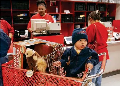  ?? Billy Calzada / Staff file photo ?? Returns surge immediatel­y after Christmas. This toy horse was being returned to Target because the boy got two of them.