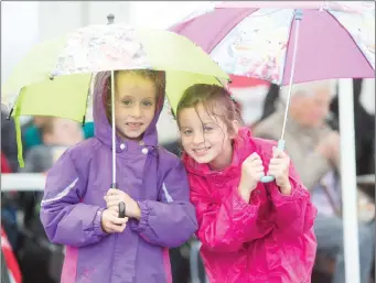  ??  ?? Amy and Rachel Bresnahan, Lissarda came prepared for the elements at the official opening of the Independen­ce Museum in Kilmurry.