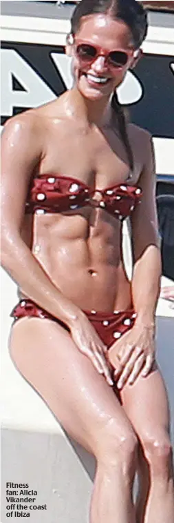  ??  ?? Fitness fan: Alicia Vikander off the coast of Ibiza