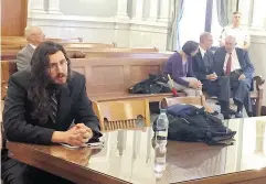  ?? DOUGLASS DOWTY / THE SYRACUSE NEWSPAPERS VIA AP ?? Michael Rotondo, left, during an eviction proceeding in Syracuse, N.Y., brought by his parents, Mark and Christina, at rear with their lawyer, Anthony Adorante.