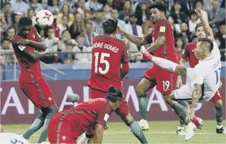  ??  ?? Chile’s Eduardo Vargas (right), who was linked with Sunderland in 2014, fires in a shot in last night’s Confederat­ions Cup clash with Portugal.