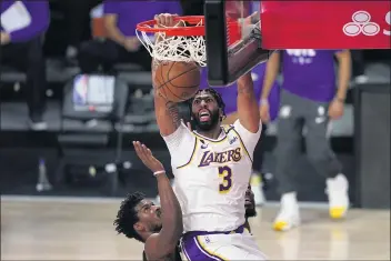  ?? MARK J. TERRILL — THE ASSOCIATED PRESS ?? A healthy Anthony Davis will be crucial to the Lakers’ hopes of repeating as NBA champions this season.
