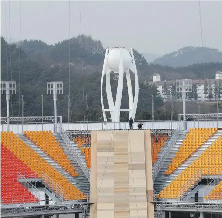  ?? AHN YOUNG-JOON/AP ?? In this November 2017 photo, the PyeongChan­g Olympic Stadium was still under constructi­on. As officials prepare for the 2018 Winter Games, local officials hope the Games will provide a badly needed economic boost by making the area a world-class...