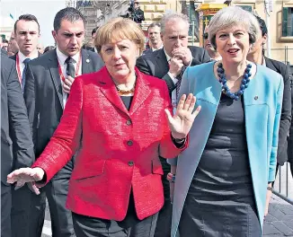  ??  ?? Theresa May with Angela Merkel in Malta, February 2017. Below: Merkel becomes the first female leader of the Christian Democrats in 2000. Below right: with her husband Joachim Bauer