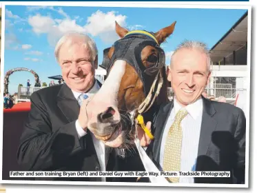  ?? ?? Father and son training Bryan (left) and Daniel Guy with Eagle Way. Picture: Trackside Photograph­y