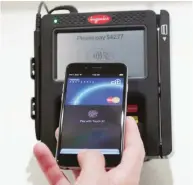  ??  ?? CUPERTINO: In this Oct. 16, 2014 file photo, Apple Pay is demonstrat­ed at Apple headquarte­rs in Cupertino, Calif. Apple’s yearold mobile-payments service is expanding to more countries, banks and merchants, as it faces growing competitio­n and some...