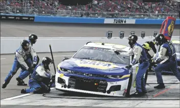  ?? ASSOCIATED PRESS ?? CHASE ELLIOTT (9) MAKES A PIT STOP for tires and fuel during the NASCAR Cup Series race at Phoenix Raceway on Sunday in Avondale.