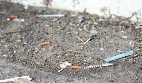  ?? CITIZEN PHOTO BY JAMES DOYLE ?? Shown here are used needles located in an alley between Quebec Street and Dominion Street last week.