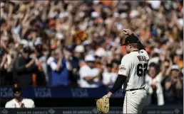  ?? JOHN HEFTI — THE ASSOCIATED PRESS ?? Giants starting pitcher Logan Webb acknowledg­es the fans as he leaves the field in the eighth inning against the San Diego Padres in San Francisco on Sunday.