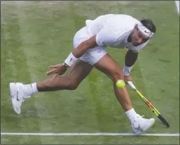  ?? The Associated Press ?? REMATCH OF 2008: Spain’s Rafael Nadal returns the ball Wednesday during a men’s quarterfin­al match against United States’ Sam Querrey on the ninth day of the Wimbledon Tennis Championsh­ips in London.