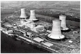  ?? ASSOCIATED PRESS 1979 ?? Three Mile Island nuclear power plant, near Harrisburg, Pa., is shown in March 1979, when equipment failure and operator errors led to a partial core meltdown of Unit 2, leading to days of fear and prompting 144,000 people to flee their homes.