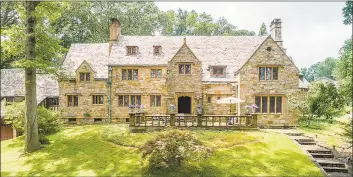  ??  ?? This English villa manor set on 3.21 acres features hand- forged iron work, leaded glass windows and exquisite Italianate details throughout.
