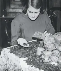 ??  ?? Look after the pennies: Joan Caley in 1939 collecting farthings for Paddington Green Children’s Hospital