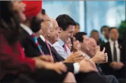  ?? CP PHOTO/SEAN KILPATRICK ?? Canadian Prime Minister Justin Trudeau gives a double thumbs up as he is introduced during an event at Sina Weibo Headquarte­rs in Beijing, China on Monday, Dec. 4 to promote Canada-China tourism.
