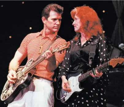  ?? Steve Castillo 1996 ?? Chris Isaak and Bonnie Raitt share the stage at the Bammies at the Warfield Theatre in March 1996.