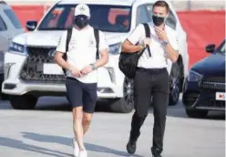  ?? Reuters ?? ↑
Mercedes’ Valtteri Bottas (left) arrives ahead of the Sakhir Grand Prix on Thursday.