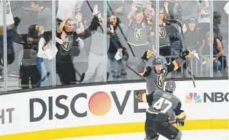  ??  ?? Vegas forward Reilly Smith celebrates his goal with Luca Sbisa during the third period of Friday’s game against Winnipeg. The Golden Knights, who won Game 4 of the Western Conference final in Las Vegas, are a win away from the Stanley Cup Final in its...