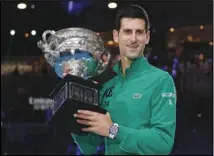  ??  ?? 17-TIME CHAMP Serbia’s Novak Djokovic holds the Norman Brookes Challenge Cup after defeating Austria’s Dominic Thiem in the men’s final of the Australian Open in Melbourne, Australia, on Sunday.