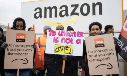  ?? Photograph: Graeme Robertson/The Guardian ?? Employees on the picket line outside Amazon’s Coventry depot are protesting against what they describe as low pay and ‘stressful’ working conditions.