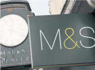  ?? REUTERS ?? Marks & Spencer (M&S) signs are seen outside a store in London.