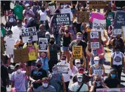  ?? MORRY GASH — THE ASSOCIATED PRESS ?? Protesters march Saturday against police violence a week after Jacob Blake was shot by an officer in Kenosha, Wis.