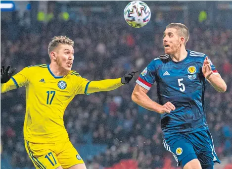  ?? Picture: SNS. ?? Declan Gallagher battles with Kazakhstan’s Abat Aimbetov on his second appearance for Scotland.